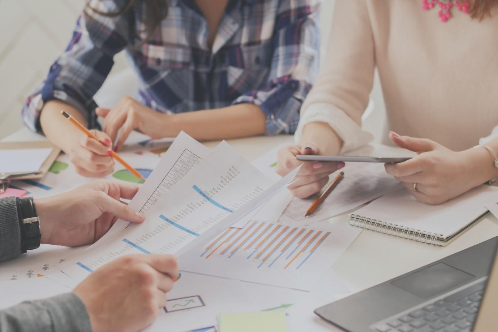 Financial analysis workspace with charts and documents